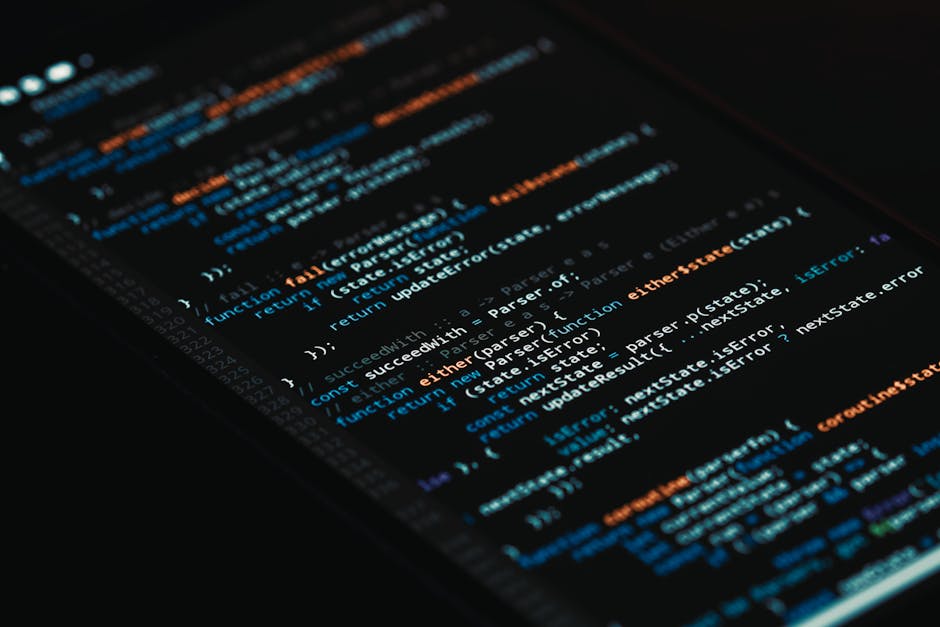 Close-up of a computer screen displaying a vibrant and colorful code editor with lines of HTML, CSS, and JavaScript code in various colors including red, green, blue, and purple, set against a dark ba